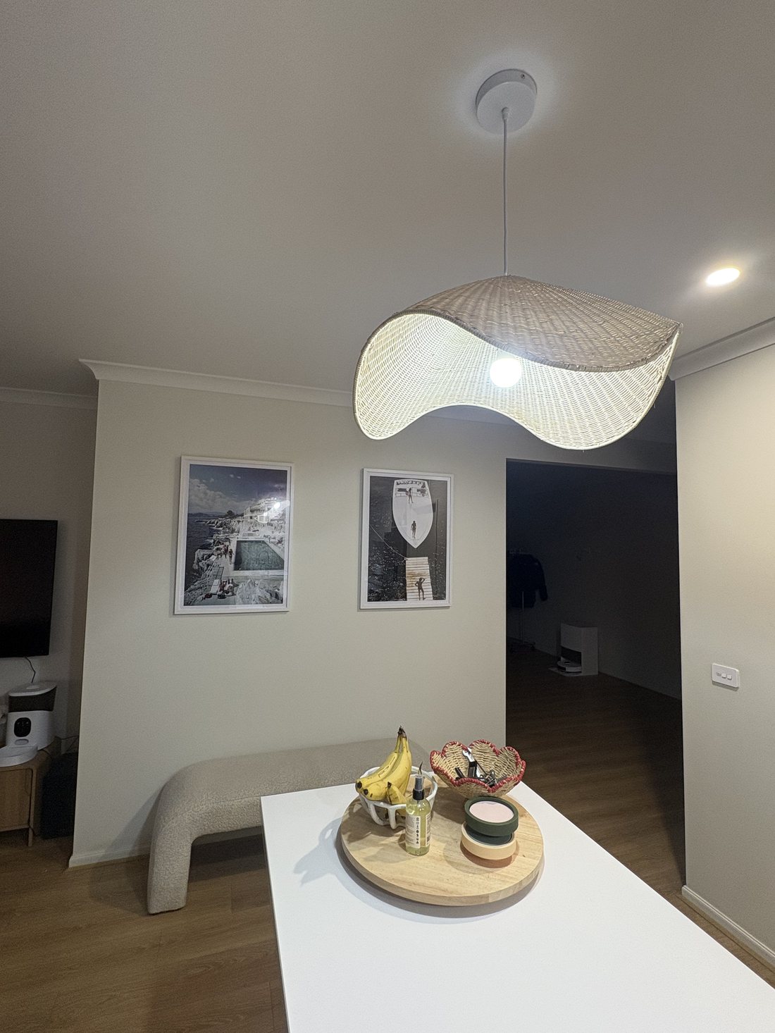 Wave-style pendant light over the dining area