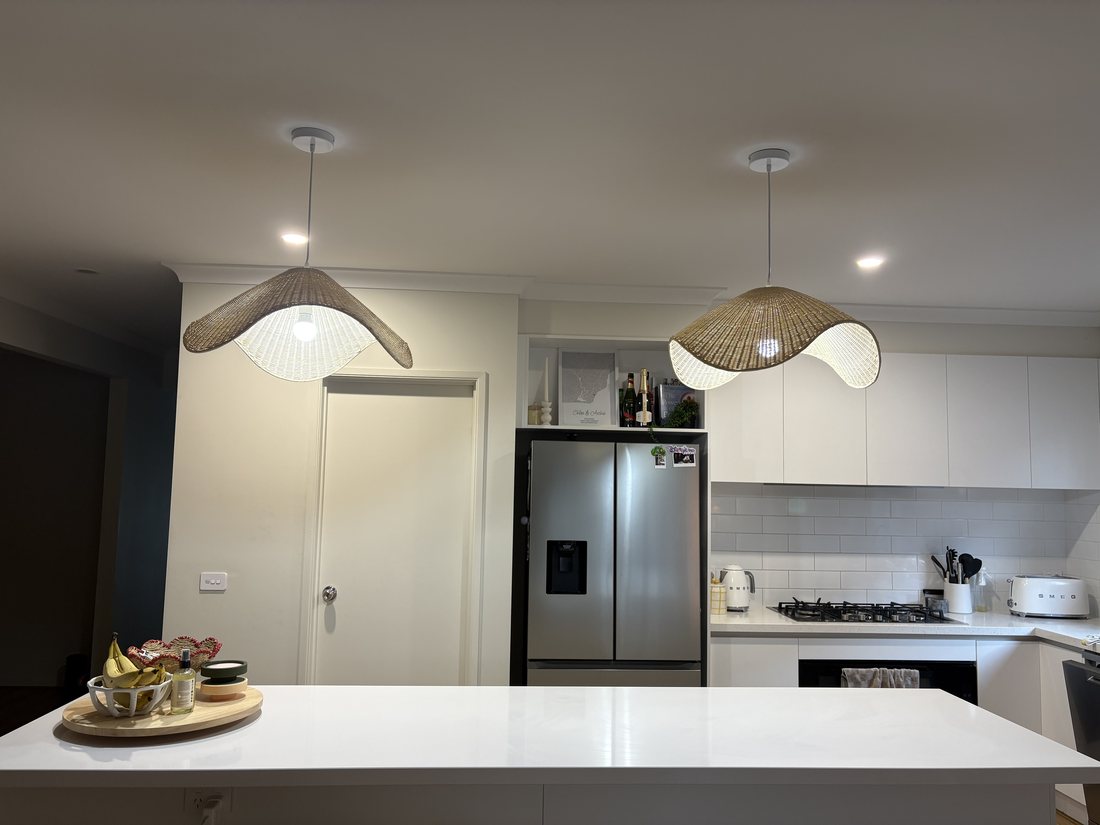 Two woven pendant lights installed over a kitchen island in Diggers Rest