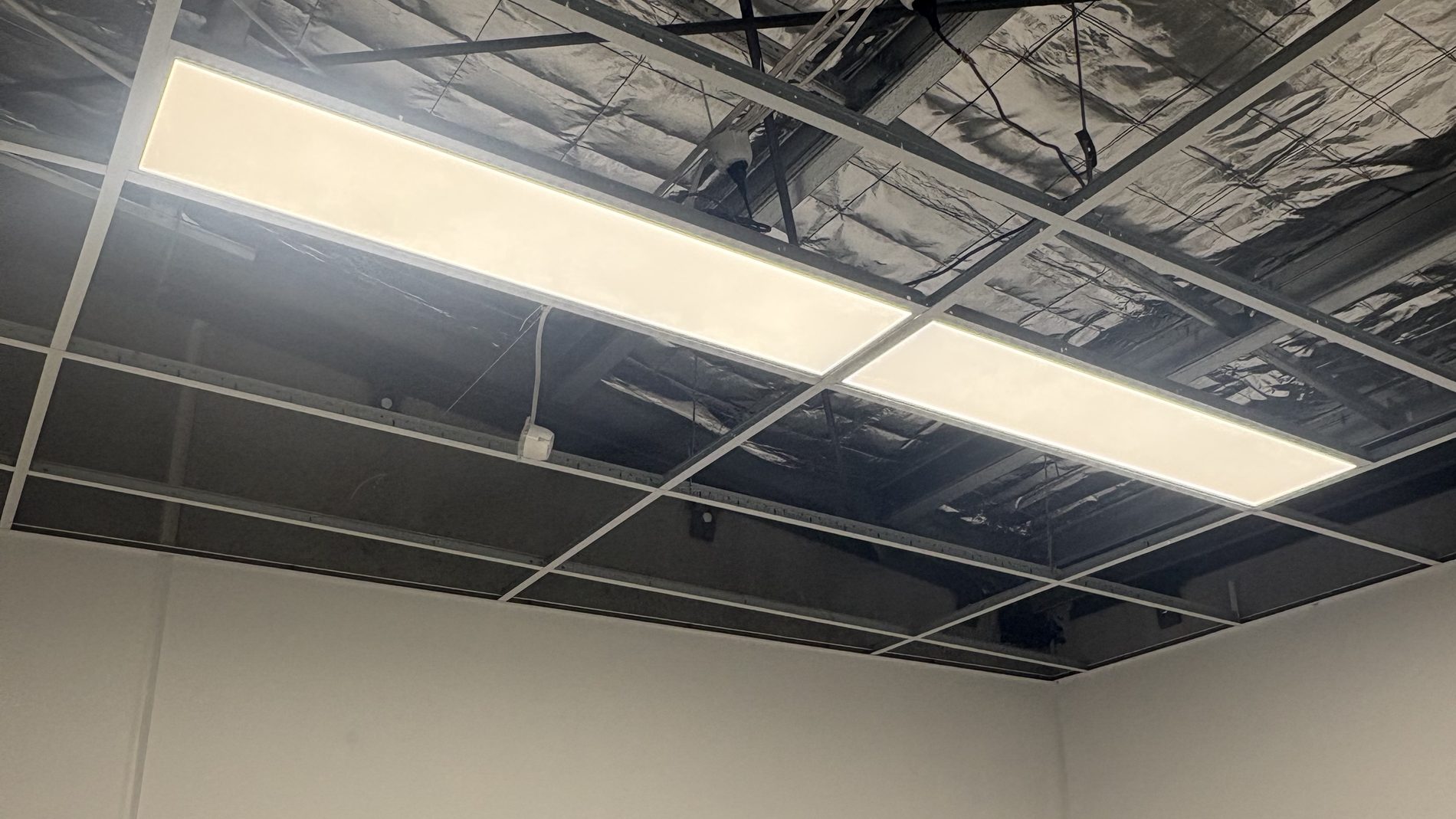 LED panel lighting installed by Litmec Electrical in a commercial suspended ceiling