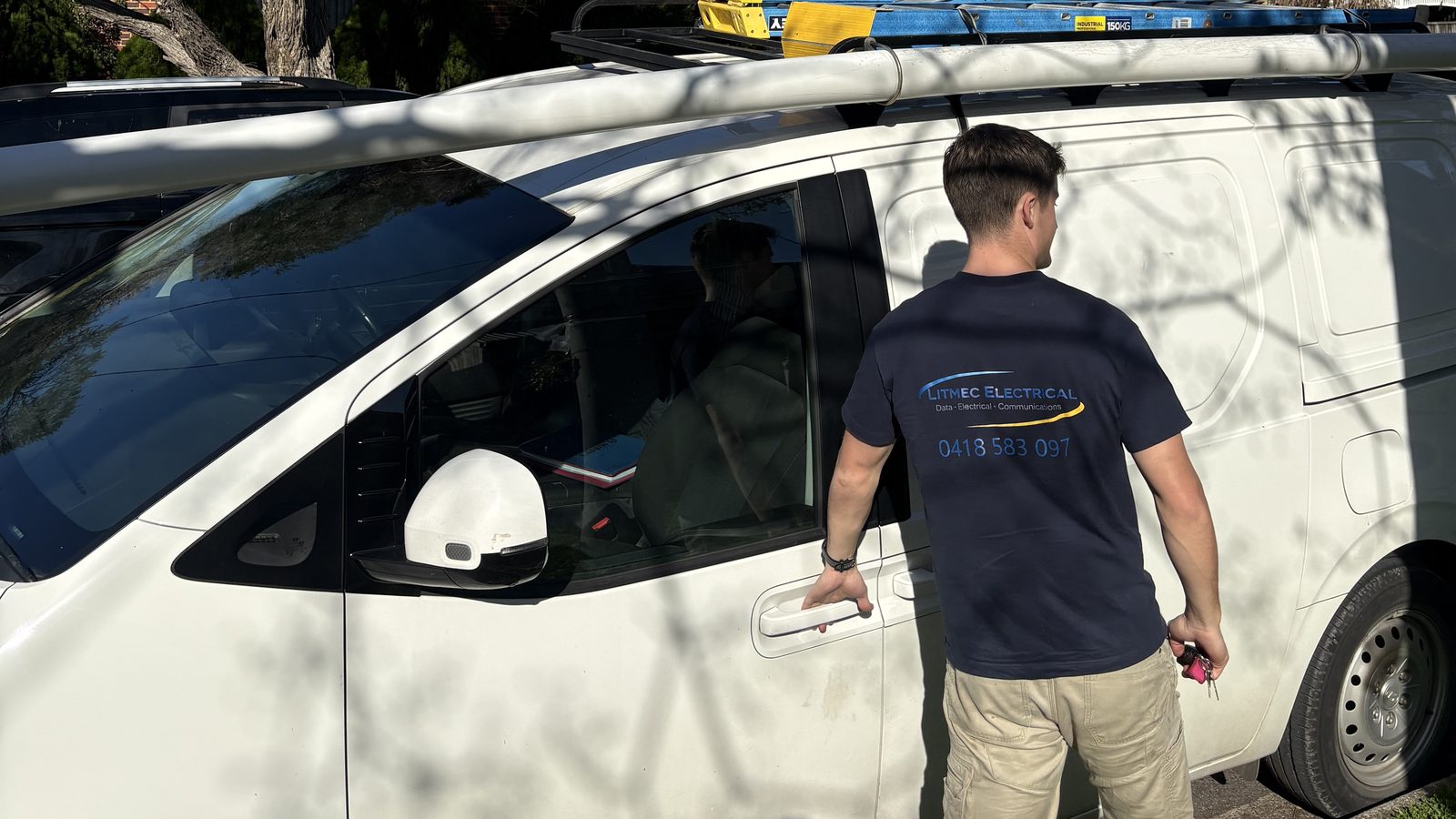 Litmec Electrical work van and electrician on site in suburban Melbourne