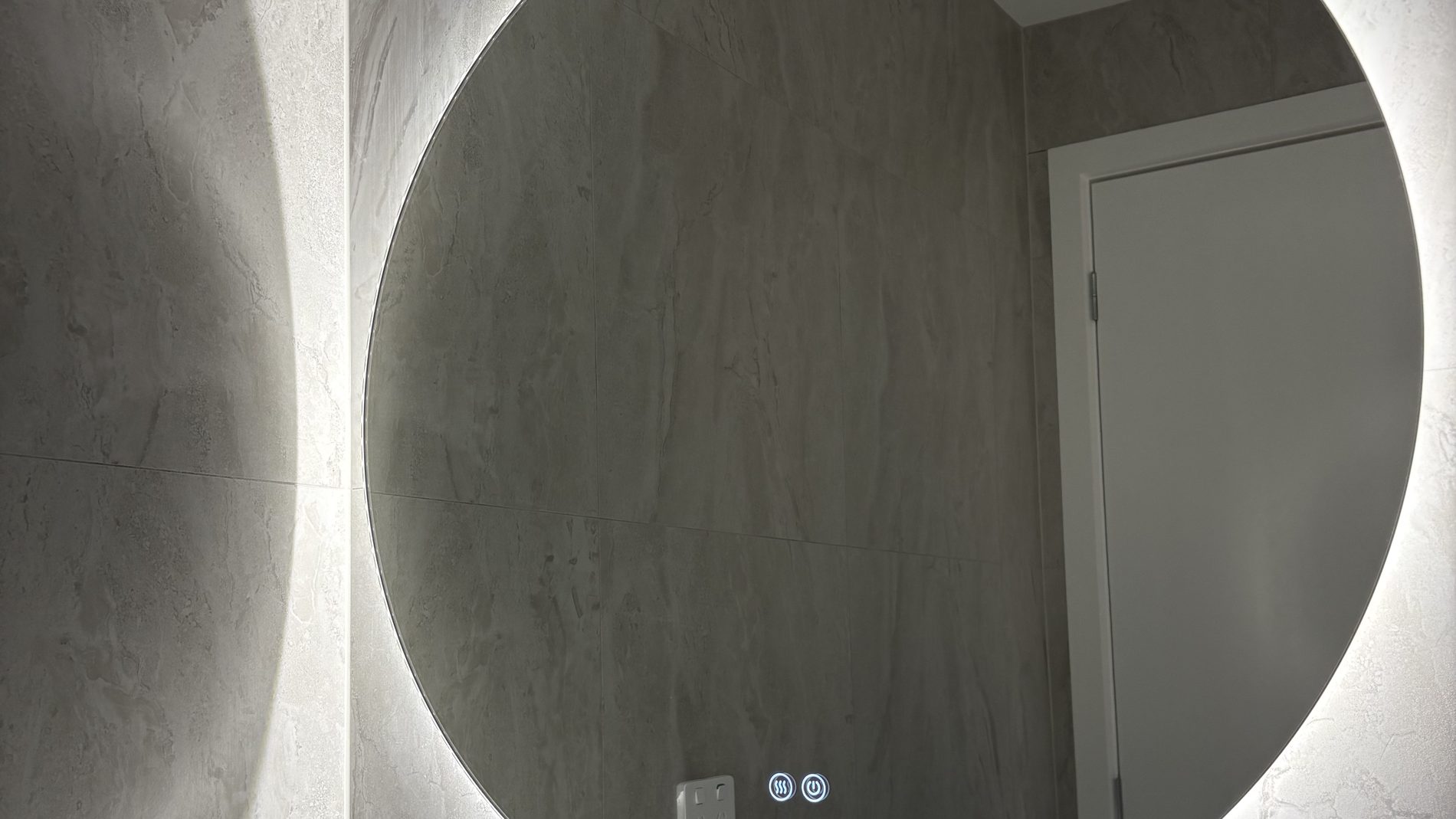 Backlit mirror and feature lighting installed by Litmec Electrical